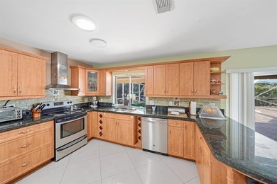 Beautifully maintained 3-bedroom, 3-bath home featuring an open on Woodlands Country Club in Florida - for sale on GolfHomes.com, golf home, golf lot