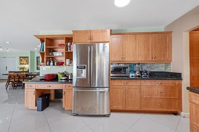 Beautifully maintained 3-bedroom, 3-bath home featuring an open on Woodlands Country Club in Florida - for sale on GolfHomes.com, golf home, golf lot