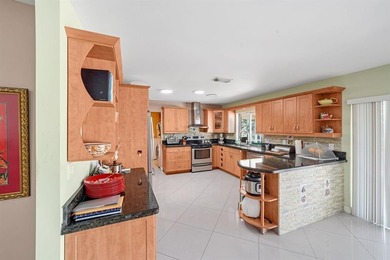 Beautifully maintained 3-bedroom, 3-bath home featuring an open on Woodlands Country Club in Florida - for sale on GolfHomes.com, golf home, golf lot