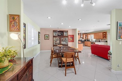 Beautifully maintained 3-bedroom, 3-bath home featuring an open on Woodlands Country Club in Florida - for sale on GolfHomes.com, golf home, golf lot