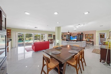 Beautifully maintained 3-bedroom, 3-bath home featuring an open on Woodlands Country Club in Florida - for sale on GolfHomes.com, golf home, golf lot