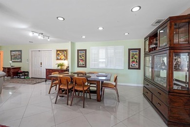 Beautifully maintained 3-bedroom, 3-bath home featuring an open on Woodlands Country Club in Florida - for sale on GolfHomes.com, golf home, golf lot