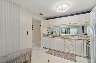 UPDATED KITCHEN WITH QUARTZ COUNTERS, IMPACT WINDOWS AND SLIDERS on Royal Wood Golf and Country Club in Florida - for sale on GolfHomes.com, golf home, golf lot