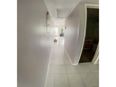 Enjoy South Florida living with this 2Bed/2Bath second floor on Hillsboro Pines Golf in Florida - for sale on GolfHomes.com, golf home, golf lot