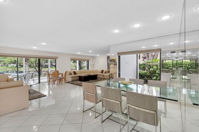 Enjoy serene water views from this light and bright first-floor on Hunters Run Golf and Country Club in Florida - for sale on GolfHomes.com, golf home, golf lot