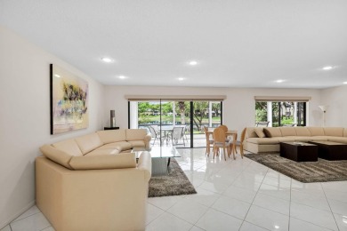 Enjoy serene water views from this light and bright first-floor on Hunters Run Golf and Country Club in Florida - for sale on GolfHomes.com, golf home, golf lot