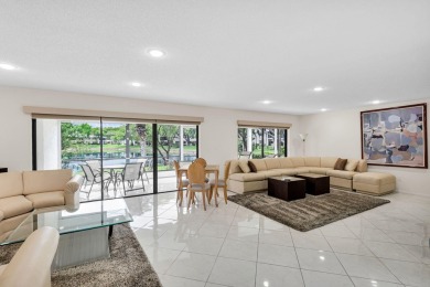 Enjoy serene water views from this light and bright first-floor on Hunters Run Golf and Country Club in Florida - for sale on GolfHomes.com, golf home, golf lot