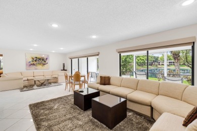 Enjoy serene water views from this light and bright first-floor on Hunters Run Golf and Country Club in Florida - for sale on GolfHomes.com, golf home, golf lot