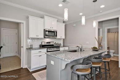 A beautiful and well-maintained home. The Owen, built by True on Cape Fear National At Brunswick Forest in North Carolina - for sale on GolfHomes.com, golf home, golf lot