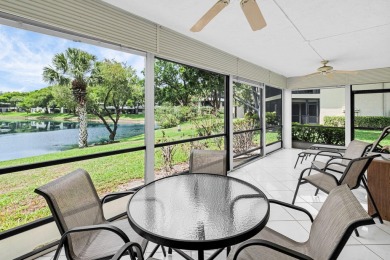 Enjoy serene water views from this light and bright first-floor on Hunters Run Golf and Country Club in Florida - for sale on GolfHomes.com, golf home, golf lot