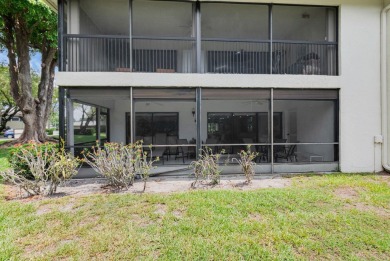 Enjoy serene water views from this light and bright first-floor on Hunters Run Golf and Country Club in Florida - for sale on GolfHomes.com, golf home, golf lot