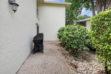 Enjoy serene water views from this light and bright first-floor on Hunters Run Golf and Country Club in Florida - for sale on GolfHomes.com, golf home, golf lot