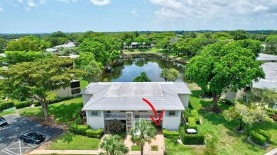 Enjoy serene water views from this light and bright first-floor on Hunters Run Golf and Country Club in Florida - for sale on GolfHomes.com, golf home, golf lot