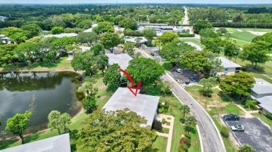 Enjoy serene water views from this light and bright first-floor on Hunters Run Golf and Country Club in Florida - for sale on GolfHomes.com, golf home, golf lot