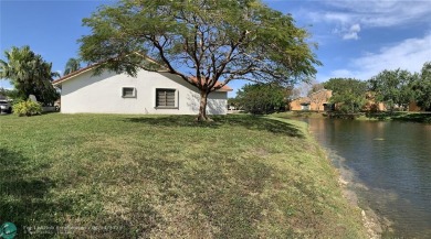 A truly spacious 3 BR/2 BA waterfront home on a cul-de-sac and on Woodmont Country Club in Florida - for sale on GolfHomes.com, golf home, golf lot
