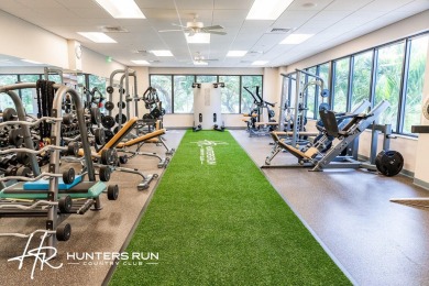 Enjoy serene water views from this light and bright first-floor on Hunters Run Golf and Country Club in Florida - for sale on GolfHomes.com, golf home, golf lot