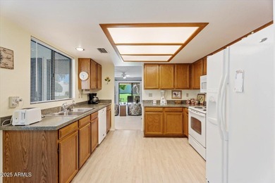 Step into this fully furnished, move-in-ready 2-BD END-UNIT on Fountain of the Sun Country Club in Arizona - for sale on GolfHomes.com, golf home, golf lot