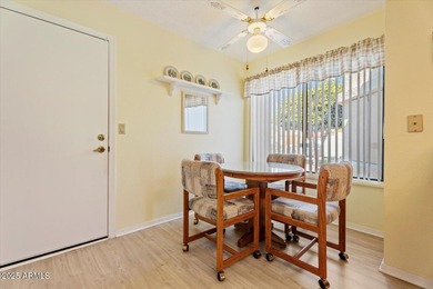 Step into this fully furnished, move-in-ready 2-BD END-UNIT on Fountain of the Sun Country Club in Arizona - for sale on GolfHomes.com, golf home, golf lot