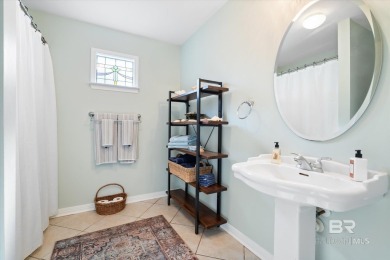 You'll fall in love with this Creole cottage-style home nestled on Isle Dauphine Club Golf Course in Alabama - for sale on GolfHomes.com, golf home, golf lot