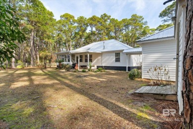 You'll fall in love with this Creole cottage-style home nestled on Isle Dauphine Club Golf Course in Alabama - for sale on GolfHomes.com, golf home, golf lot