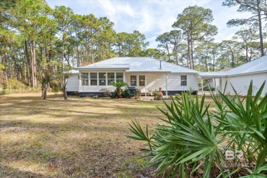 You'll fall in love with this Creole cottage-style home nestled on Isle Dauphine Club Golf Course in Alabama - for sale on GolfHomes.com, golf home, golf lot