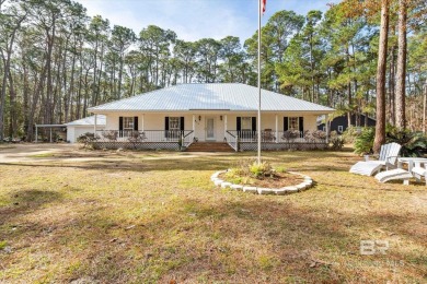 You'll fall in love with this Creole cottage-style home nestled on Isle Dauphine Club Golf Course in Alabama - for sale on GolfHomes.com, golf home, golf lot