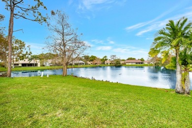 Magnificent lake view 2 bedroom, 2 bathroom, 2 car garage home on Boca Delray Golf and Country Club in Florida - for sale on GolfHomes.com, golf home, golf lot