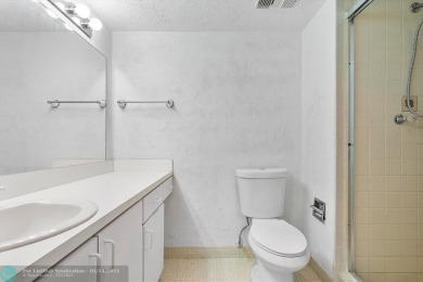 This spacious 3-bedroom, 2.5-bathroom corner unit townhome is on Pine Island Ridge Country Club in Florida - for sale on GolfHomes.com, golf home, golf lot