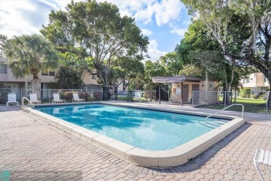 This spacious 3-bedroom, 2.5-bathroom corner unit townhome is on Pine Island Ridge Country Club in Florida - for sale on GolfHomes.com, golf home, golf lot