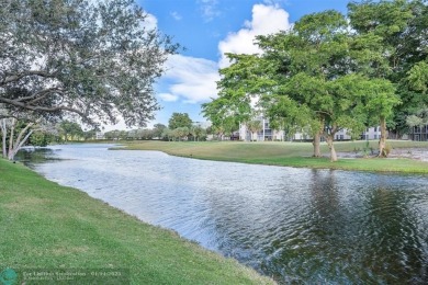 This spacious 3-bedroom, 2.5-bathroom corner unit townhome is on Pine Island Ridge Country Club in Florida - for sale on GolfHomes.com, golf home, golf lot