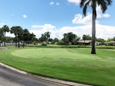 Magnificent lake view 2 bedroom, 2 bathroom, 2 car garage home on Boca Delray Golf and Country Club in Florida - for sale on GolfHomes.com, golf home, golf lot