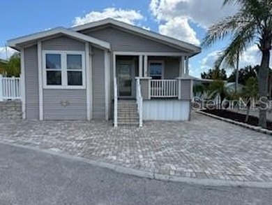 Check out this cute as can be MH Home where you OWN your lot! on Southern Dunes Golf and Country Club in Florida - for sale on GolfHomes.com, golf home, golf lot