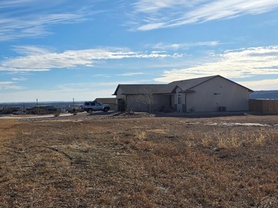 Vacant building lot on paved Cuerno Verde with water and sewer on Hollydot Golf Course in Colorado - for sale on GolfHomes.com, golf home, golf lot