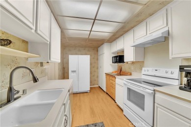 Set on a premium corner lot along the 8th fairway, this Casa on Leisure Village Par 3 Golf Course in California - for sale on GolfHomes.com, golf home, golf lot