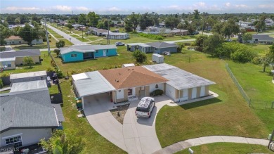 CHARMING MID-CENTURY HOME IN A QUIET CUL-DE-SAC WITH WATER VIEWS on Port Charlotte Golf Club in Florida - for sale on GolfHomes.com, golf home, golf lot