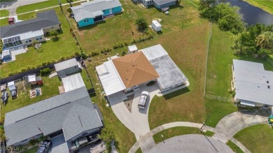 CHARMING MID-CENTURY HOME IN A QUIET CUL-DE-SAC WITH WATER VIEWS on Port Charlotte Golf Club in Florida - for sale on GolfHomes.com, golf home, golf lot