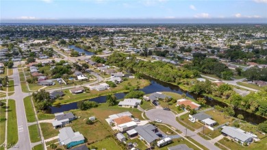 CHARMING MID-CENTURY HOME IN A QUIET CUL-DE-SAC WITH WATER VIEWS on Port Charlotte Golf Club in Florida - for sale on GolfHomes.com, golf home, golf lot