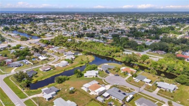 CHARMING MID-CENTURY HOME IN A QUIET CUL-DE-SAC WITH WATER VIEWS on Port Charlotte Golf Club in Florida - for sale on GolfHomes.com, golf home, golf lot