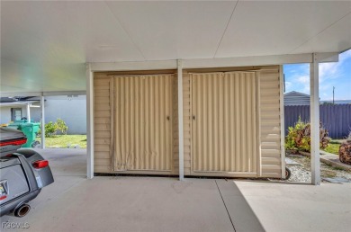 CHARMING MID-CENTURY HOME IN A QUIET CUL-DE-SAC WITH WATER VIEWS on Port Charlotte Golf Club in Florida - for sale on GolfHomes.com, golf home, golf lot