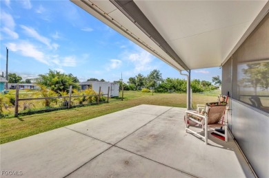 CHARMING MID-CENTURY HOME IN A QUIET CUL-DE-SAC WITH WATER VIEWS on Port Charlotte Golf Club in Florida - for sale on GolfHomes.com, golf home, golf lot