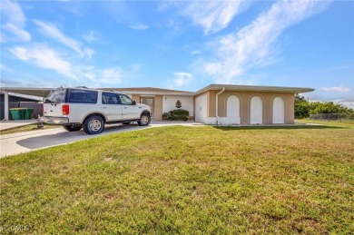 CHARMING MID-CENTURY HOME IN A QUIET CUL-DE-SAC WITH WATER VIEWS on Port Charlotte Golf Club in Florida - for sale on GolfHomes.com, golf home, golf lot