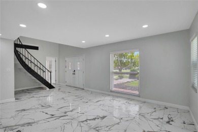 Discover this beautifully renovated 4-bedroom, 3-bath,  dream on Temple Terrace Golf and Country Club in Florida - for sale on GolfHomes.com, golf home, golf lot