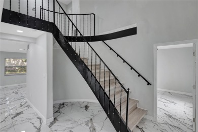 Discover this beautifully renovated 4-bedroom, 3-bath,  dream on Temple Terrace Golf and Country Club in Florida - for sale on GolfHomes.com, golf home, golf lot