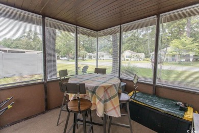 Step into the serene oasis of Myrtle Beach Golf & Yacht, a on Heron Point Golf Club in South Carolina - for sale on GolfHomes.com, golf home, golf lot