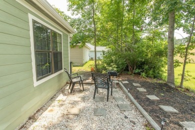 Step into the serene oasis of Myrtle Beach Golf & Yacht, a on Heron Point Golf Club in South Carolina - for sale on GolfHomes.com, golf home, golf lot