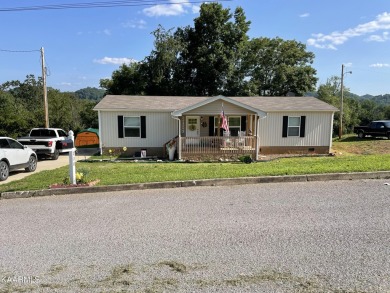 This is a beautiful, well cared for home,  It has a nice covered on Woodlake Golf Club in Tennessee - for sale on GolfHomes.com, golf home, golf lot