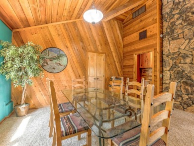 Tucked away amid whispering pines and just a short walk to the on Angel Fire Resort Country Club in New Mexico - for sale on GolfHomes.com, golf home, golf lot