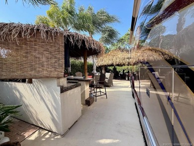 YOUR TROPICAL OASIS AWAITS! Ideally situated near the north on St. Lucie Trail Golf Club in Florida - for sale on GolfHomes.com, golf home, golf lot