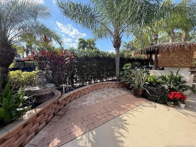 YOUR TROPICAL OASIS AWAITS! Ideally situated near the north on St. Lucie Trail Golf Club in Florida - for sale on GolfHomes.com, golf home, golf lot