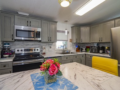 No age restriction in Barefoot Bay! Enjoy this spacious 2/2 with on Barefoot Bay Golf Course in Florida - for sale on GolfHomes.com, golf home, golf lot